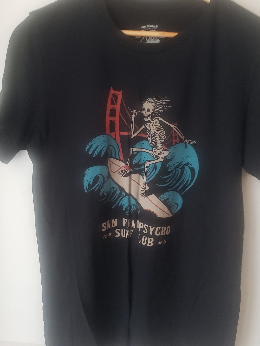 surf style Black Graphic Tee with Teal and Red Surf Skeleton